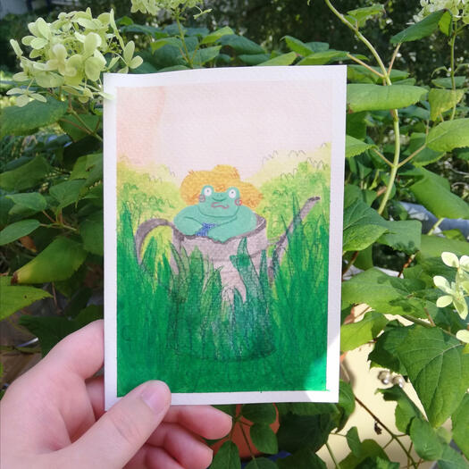 Frog wearing sun hat sitting in a watering can watercolor card